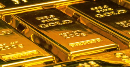 Gold bars in a secure vault representing central-bank reserves held in London