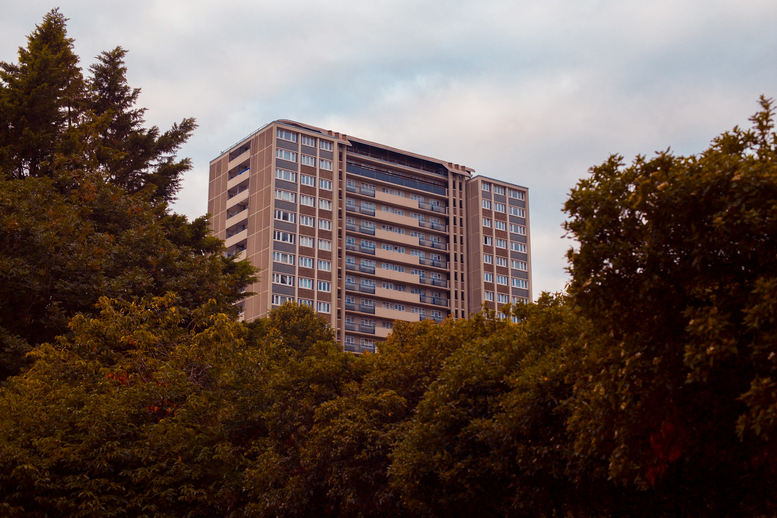 Leasehold apartment buildings and estate agent signs in the UK