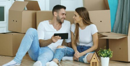 First-time buyers outside a new-build home under the Your First Home scheme