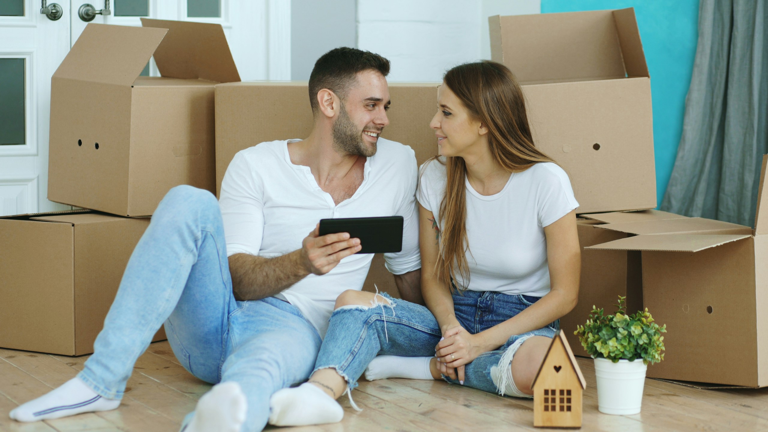 First-time buyers outside a new-build home under the Your First Home scheme