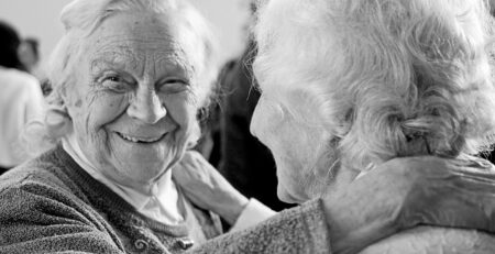 - Older couple reviewing their household finances at home